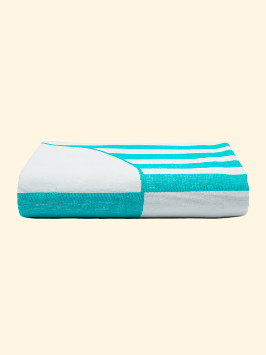 Model “Mayeri” of Tucca light beach towel 100% organic cotton, perfectly folded as presented on the packaging. Showing that is a very thing beach towel easy to carry.