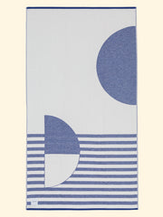 Tucca "Florida" extra light beach towel extended. Light mustard yellow and white colors in big blocks composing a beautiful design. Large beach towel that doesn't get blown by the wind. Super soft texture as it is made with 100% organic cotton.