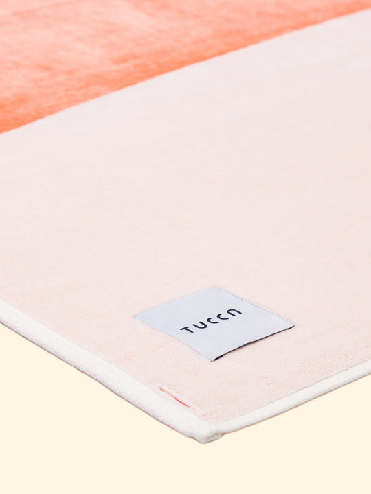 Model “Konoh” of Tucca beach towel 100% organic cotton, folded while showing the top side finished in terry velour, making it softer and lighter. 